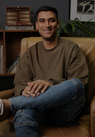 Yuvaan Malkani sitting on a chair with legs crossed