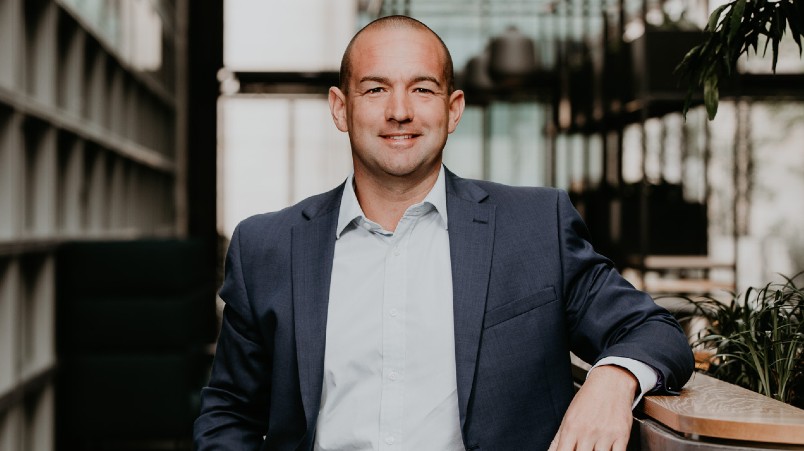 Mark Frain standing in an office